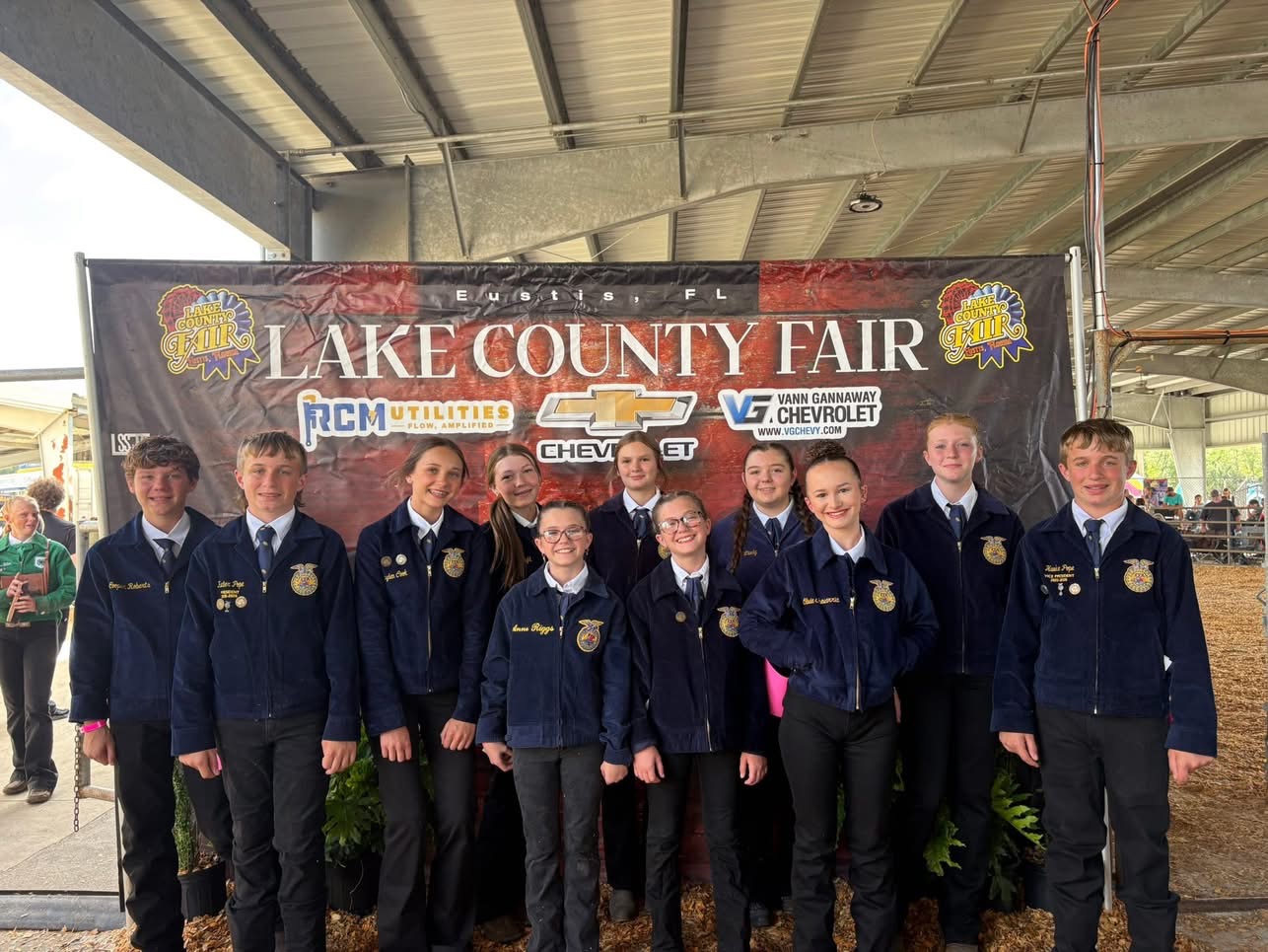 Local FFA chapter members in blue jackets at the Lake County Fair in Eustis, Florida